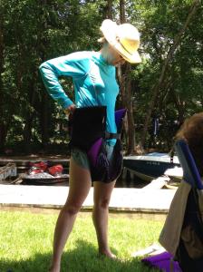 K demonstrates the proper way to wear a life vest for leisurely floating in the water.  We call this "the diaper."